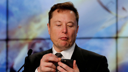 Elon Musk on his phone