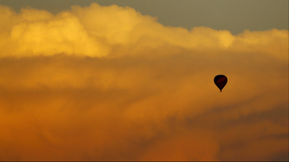 hot air balloon among clouds