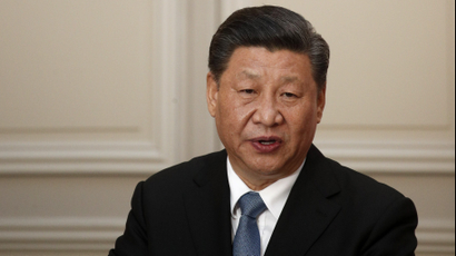 Chinese President Xi Jinping reacts during a press conference. He does not look pleased.