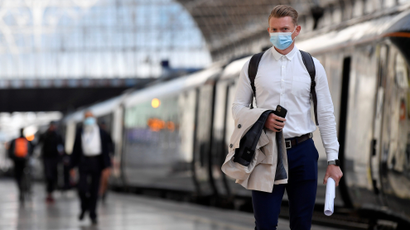 Commuters wearing face masks arrive at Paddington Station following the outbreak of the coronavirus disease (COVID-19) in London, Britain June 15, 2020.
