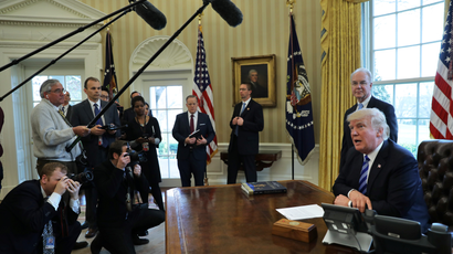 U.S. President Donald Trump talks to journalists at the Oval Office of the White House after the AHCA health care bill was pulled before a vote.
