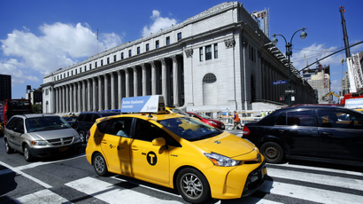 In this Aug. 15, 2016 file photo, a taxi drives past the James A Farley Post Office Building in New York.