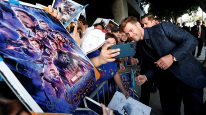 Cast member Chris Hemsworth poses with fans on the red carpet at the world premiere of the film "The Avengers: Endgame" in Los Angeles