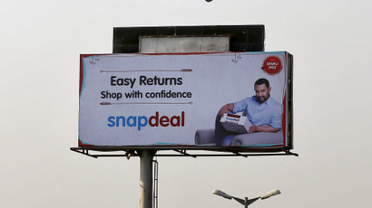 An IndiGo Airlines aircraft flies above an advertisement of Indian online marketplace Snapdeal featuring Bollywood actor Aamir Khan, in Mumbai, India, October 16, 2015. Amazon.com Inc could emerge as the biggest winner from one of India's most important festive - and shopping - seasons, after the e-tailer offered steep discounts, swift delivery and even gold bars to grab market share. The month-long festive season, which began on Monday, culminates in Diwali, or the Festival of Lights, but the first nine days are considered an especially auspicious time to make big purchases. Analysts say e-commerce firms in India could make as much as a quarter of their annual sales during this period, with the global experience, logistics network and deep pockets of Amazon putting it in a good position to grab customers from local market leader Flipkart and smaller firm Snapdeal. REUTERS/Shailesh Andrade - GF10000246866
