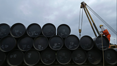 A worker prepares to transport oil pipelines