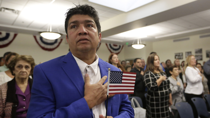 the "Pledge of Allegiance" during a US naturalization ceremony