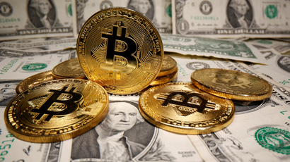 An illustration of bitcoins and dollar bills