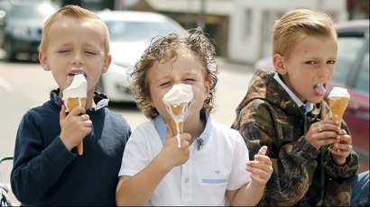 Children eat ice cream at Appleby-in-Westmorland, Britain June 4, 2015.