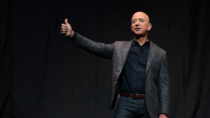 Amazon's Jeff Bezos gives a thumbs up as he speaks during an event about Blue Origin's space exploration plans in Washington in 2019.