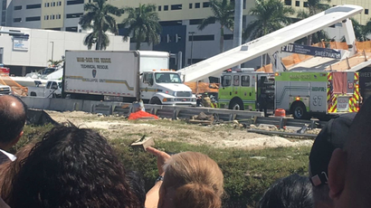 A brand new pedestrian bridge collapses in Miami.