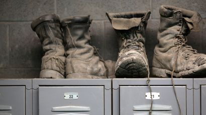 Coal mining boots are shown above miners' lockers before the start of an afternoon shift at a coal mine near Gilbert, West Virginia