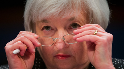 Federal Reserve Chair Janet Yellen removes her glasses as she testifies on Capitol Hill in Washington, Wednesday, Feb. 25, 2015, before the House Financial Services Committee hearing: "Monetary Policy and the State of the Economy.