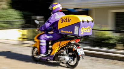 Getir delivery worker riding on bike.