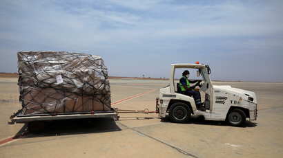 Airport workers drive a cart with shipment of medical supplies donated to help Africa for fight with the coronavirus disease (COVID-19) from Chinese billionaire Jack Ma and the Alibaba Foundation, after it arrived from Ethiopia at Blaise Diagne international airport in Thies, Senegal March 28, 2020.