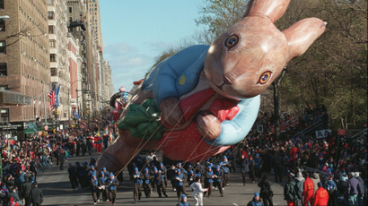 Handlers struggle with a wind-whipped Peter Rabbit balloon during Macy's 71st annual Thanksgiving Day Parade in New York, Thursday, Nov. 27, 1997. Wind gusts of 40 mph were reported in the area as the parade, famous for its huge helium balloons of cartoon characters, got under way.