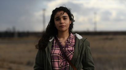 Valeria Murguia, 21, a university student, poses for a photograph in a field near her home in McFarland, California, U.S., December 17, 2020.