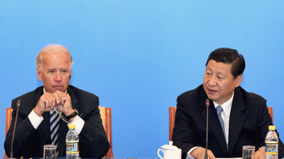 China's Vice President Xi Jinping (R) speaks next to U.S. Vice President Joe Biden during a discussion with U.S. and Chinese business leaders at Beijing Hotel in Beijing August 19, 2011.