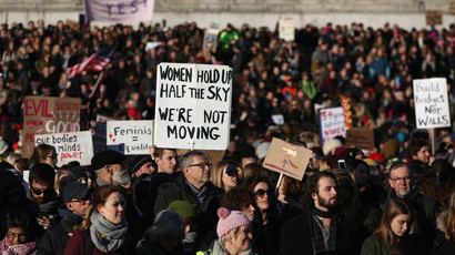 Protesters carrying banners take part in the Women's March on London, as they stand in Trafalgar Square, in central London, Britain January 21, 2017. The march formed part of a worldwide day of action following the election of Donald Trump to U.S. President. REUTERS/Neil Hall - RTSWOA2