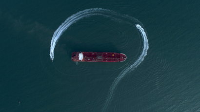 an aerial view shows a speedboat of Iran's Revolutionary Guard moving around the British-flagged oil tanker Stena Impero