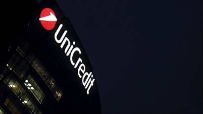 UniCredit building at night in Milan