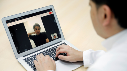 A doctor conducts a telehealth visit