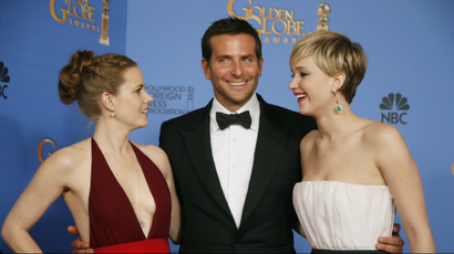 "American Hustle" stars Amy Adams (L), Bradley Cooper and Jennifer Lawrence pose after the Golden Globe awards.