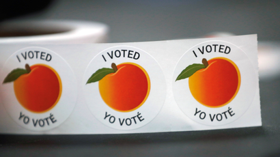 "I Voted / Yo Vote" stickers sit on a table to be given to people after they cast their votes in the 2018 U.S. midterm election in Georgia
