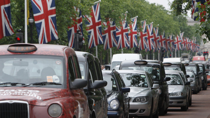 Cars queue up the Mall, London.