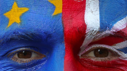 An anti-Brexit protester with painted EU and British flags on his face is seen ahead of a EU Summit in front of European Commission headquarters in Brussels
