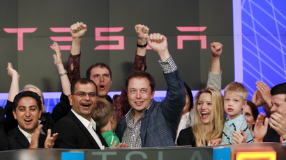 CEO of Tesla Motors Elon Musk waves after ringing the opening bell at the NASDAQ market in celebration of his company's initial public offering in New York June 29, 2010.