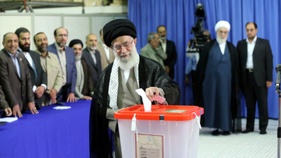 Iran's Supreme Leader Ayatollah Ali Khamenei casts his ballot at his office during the Iranian presidential election in central Tehran June 14, 2013. Iranians voted for a new president on Friday urged by Khamenei to turn out in force to discredit suggestions by arch foe the United States that the election would be unfair.