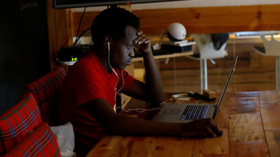 An employee of the startup Kytabu, works in the company's office in Nairobi, Kenya