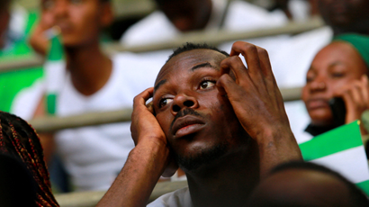 A Nigerian fan looks disappointed during the World Cup qualifier between Nigeria and Ghana