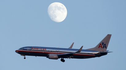 An American Airlines passenger jet comes in the land at LaGuardia airport in New York