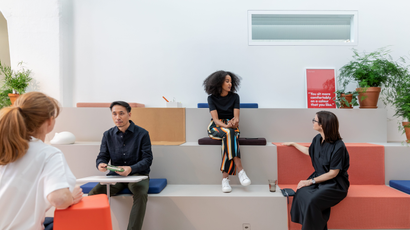 Employees collaborating in a Vitra "club office" configuration