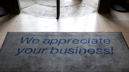 A floor mat says "We appreciate your business!"