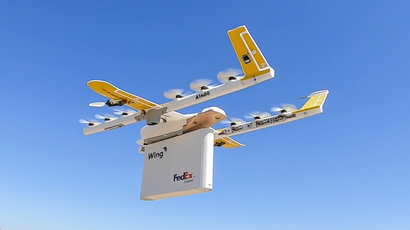 The Wing drone delivering a FedEx package.