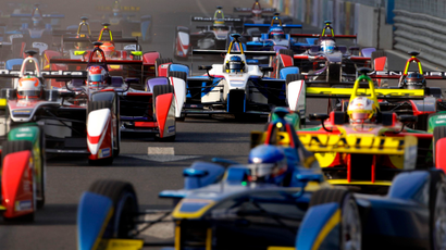 Formula E cars drive into a corner during the Formula E Championship race in Beijing September 13, 2014. The inaugural Formula E Championship, which according to its organisers is the world's first fully electric racing series, will be contested by 10 two-driver teams over 10 rounds. REUTERS/Barry Huang (CHINA - Tags: SPORT MOTORSPORT SCIENCE TECHNOLOGY) - RTR462K9