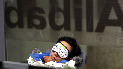 An employee takes a nap during a break inside the headquarters of Alibaba