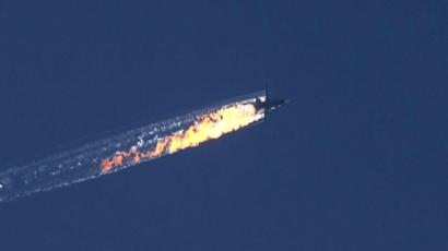 A still image made available on 24 November 2015 from video footage shown by the HaberTurk TV Channel shows a burning trail as a plane comes down after being shot down near the Turkish-Syrian border, over north Syria, 24 November 2015.