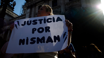 A woman holds a sign that reads, "Justice for Nisman" during a demonstration outside Argentina's Congress in Buenos Aires February 4, 2015. Various rights groups marched through Buenos Aires to demand full disclosure of the AMIA Jewish community center case and justice over the mysterious death of prosecutor Alberto Nisman, who was investigating the 1994 bombing of the AMIA.