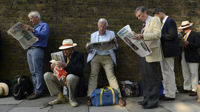 men reading the newspaper