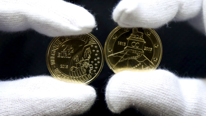 A worker displays newly minted commemorative 2.5 euro coins to mark the bicentennial of the battle of Waterloo, at Belgium's Royal Mint in Brussels June 8, 2015.