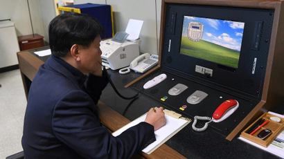 Korean government official checks the direct communications hotline to talk with the North Korean side at the border village of Panmunjom
