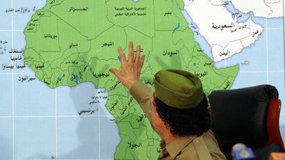 Libyan leader Moammar Gadhafi talks during a press conference in front of Africa map in Tripoli, Libya, Tuesday, Jan. 29, 2008.