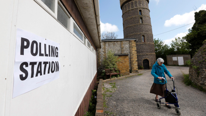 A woman arrives at a polling station in Broadstairs, southeast Britain