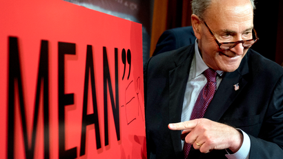 Senate Minority Leader Chuck Schumer, D-N.Y., writes "Mean-er" on a reported quote by President Donald Trump as Schumer responds to the release of the Republicans' healthcare bill which represents the long-awaited attempt to scuttle much of President Barack Obama's Affordable Care Act, at the Capitol in Washington, Thursday, June 22, 2017.