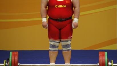 DATE IMPORTED:December 11, 2009China's Qi Xihui waits to compete during the clean and jerk session of the women's +75kg competition at the East Asian Games in Hong Kong December 11, 2009. REUTERS/Tyrone Siu