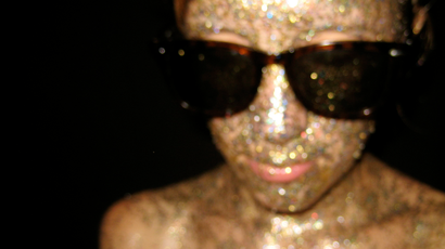 girl with glitter on her face.