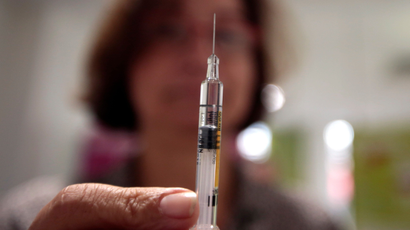 A nurse holds a syringe as part of the start of the seasonal influenza vaccination campaign in Nice